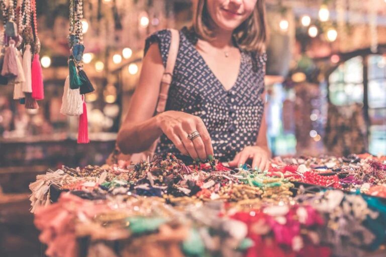 woman selecting beaded jewelry