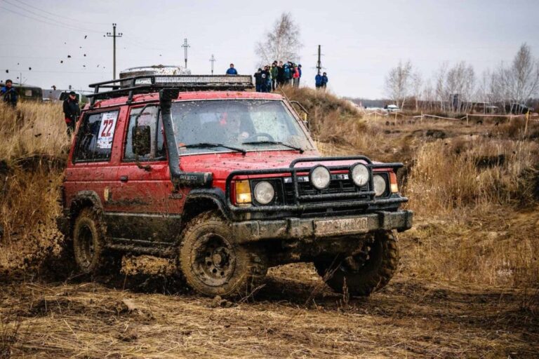 red suv on mud track