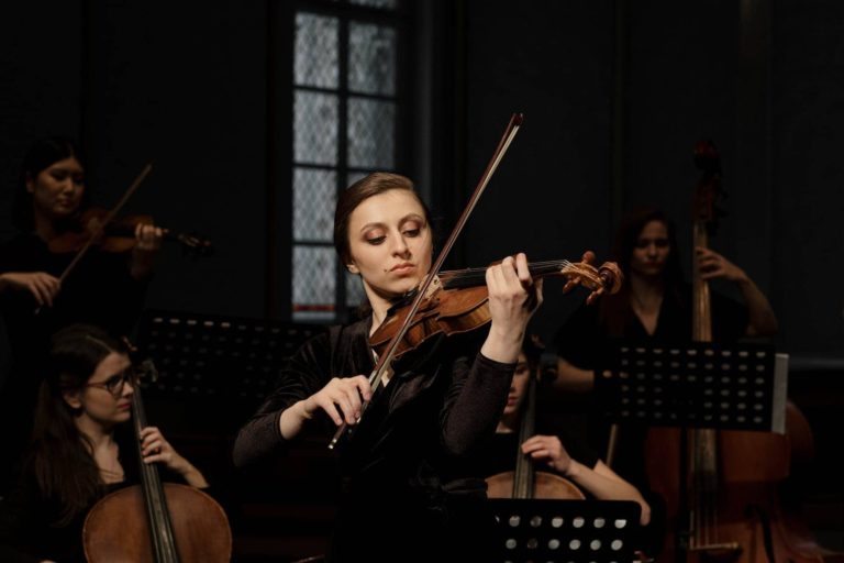 group of women playing musical instruments